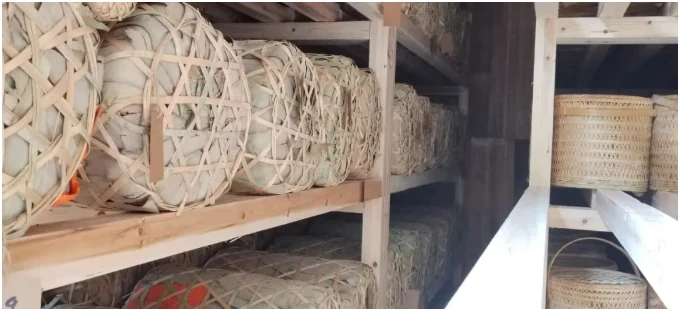Bamboo tea baskets arranged on storage shelves