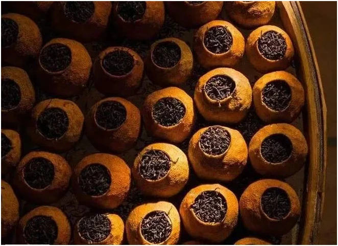 Dried mature citrus shells filled with dark tea