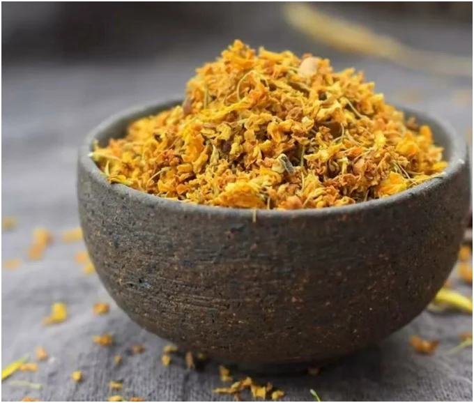 Dried food-grade osmanthus flowers in a bowl