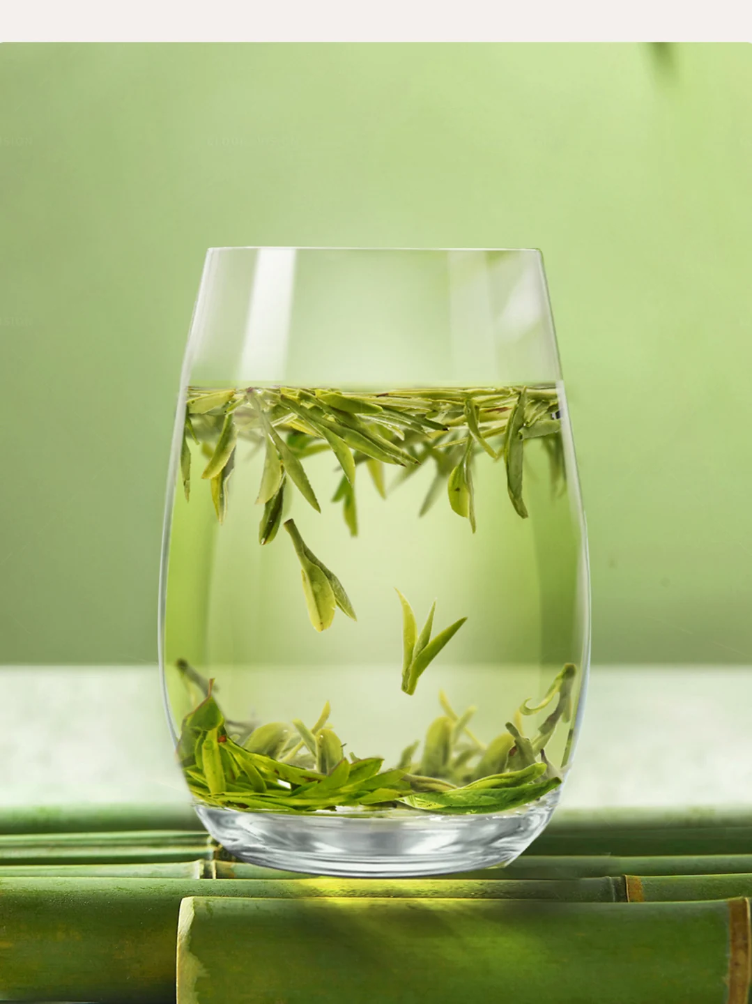 Opened Longjing tea leaves in pale green tea liquor