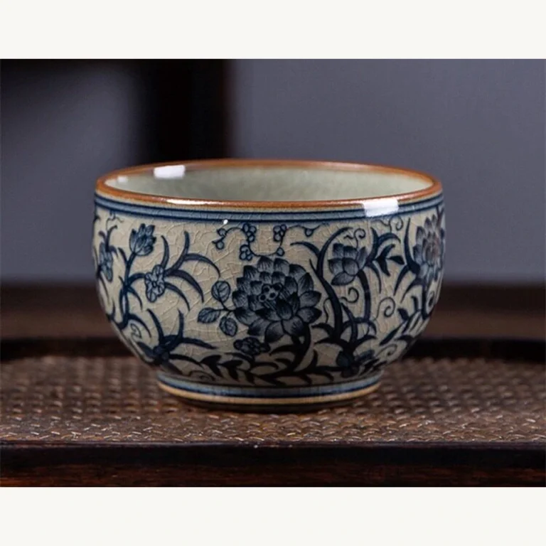 Front view of the hand-painted blue and white lotus teacup with crackle glaze