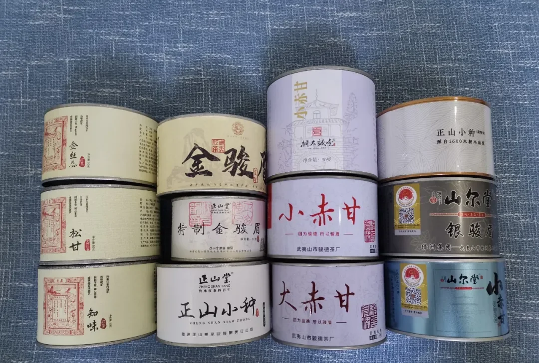 Sample tins for price comparison — source photograph, not a current price quote or independent product rating