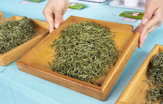 Dry tea examined on a tray before brewing