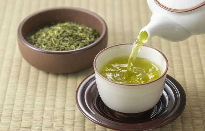 Tea being poured into a bowl