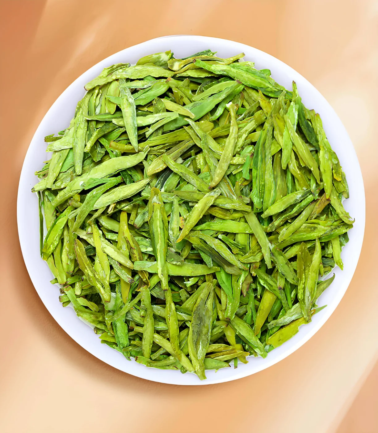 Dry Longjing leaves in a white bowl on a pale background