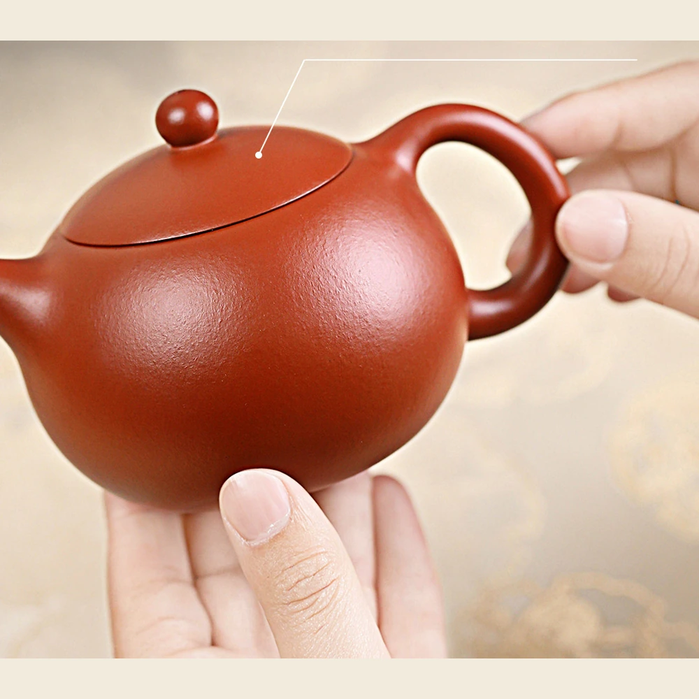 Handheld view of the Zhuni Xishi Yixing teapot