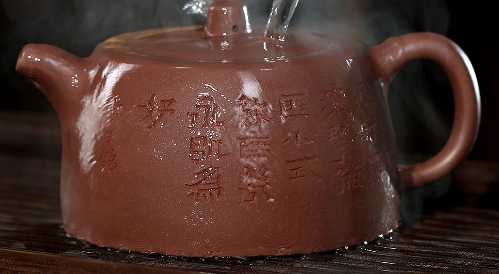 Low Jinglan teapot being rinsed with water