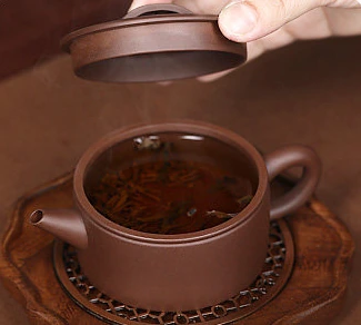 Open Hanwa teapot with lifted lid, showing its broad mouth and interior