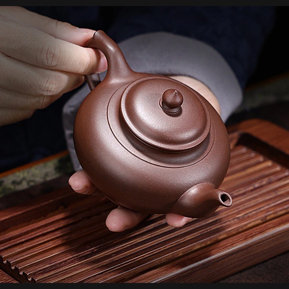 Ручной снимок сверху крышки Xiaoying, дна и ручки петлеобразная ручка